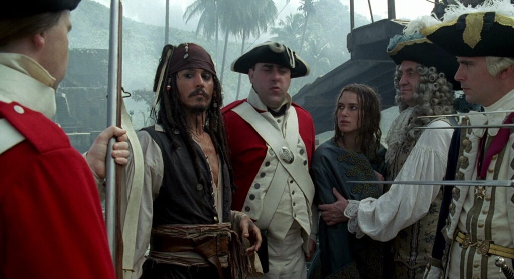 Jack Sparrow (Johnny Depp) looking at the guards in 'Pirates of the Caribbean: The Curse of the Black Pearl' (2003)