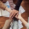 Photo Of People Near Wooden Table; How To Make Sure Your Script’s Diversity Makes It to Screen